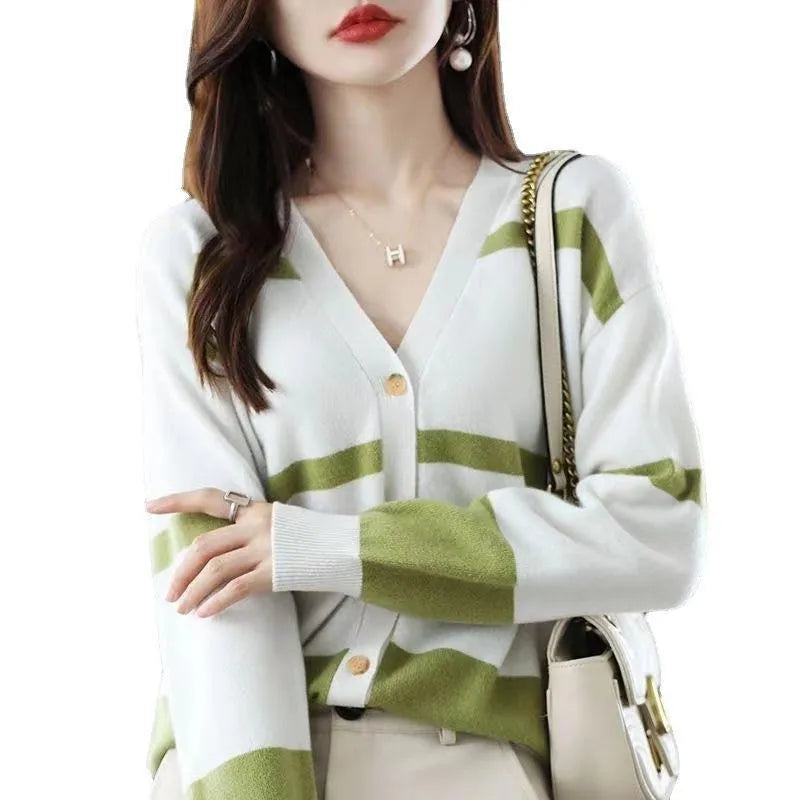 Women's striped V-neck knitted cardigan with 3D patterned sleeves and button front in a slim fit.