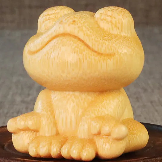 Solid bamboo carving ornament with smiling frog cartoon design, 5cm height