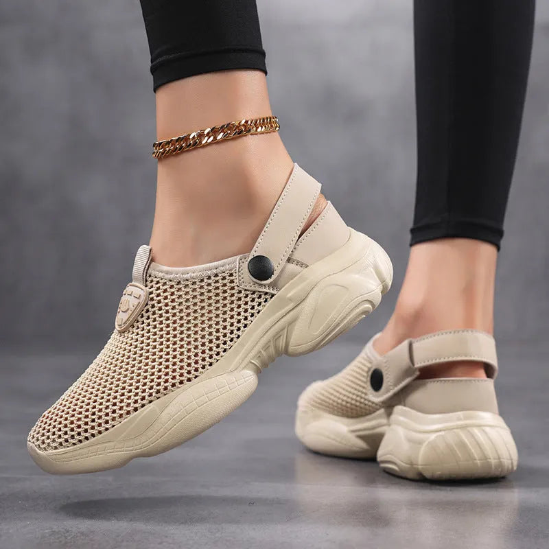 Women's beige Flyknit casual sports sandals with round toe holder, shown on a foot.