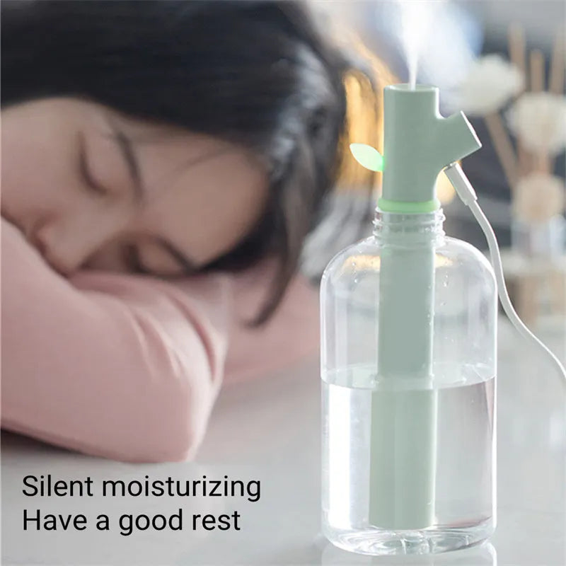 Transparent plastic USB portable humidifier with water tank on desk