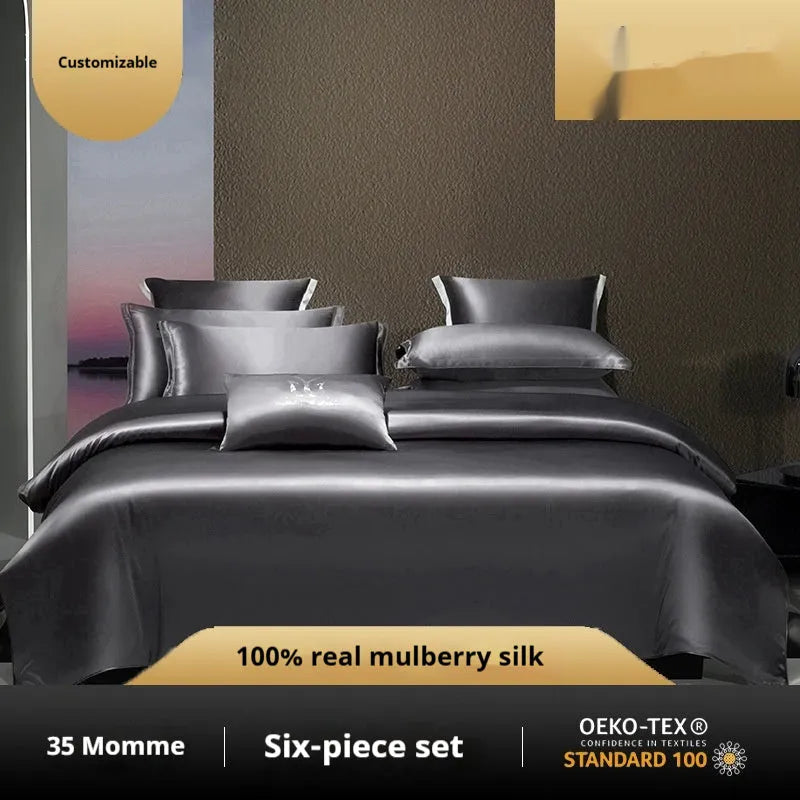 Solid colour silk quilt cover four-piece bedding set shown on bed