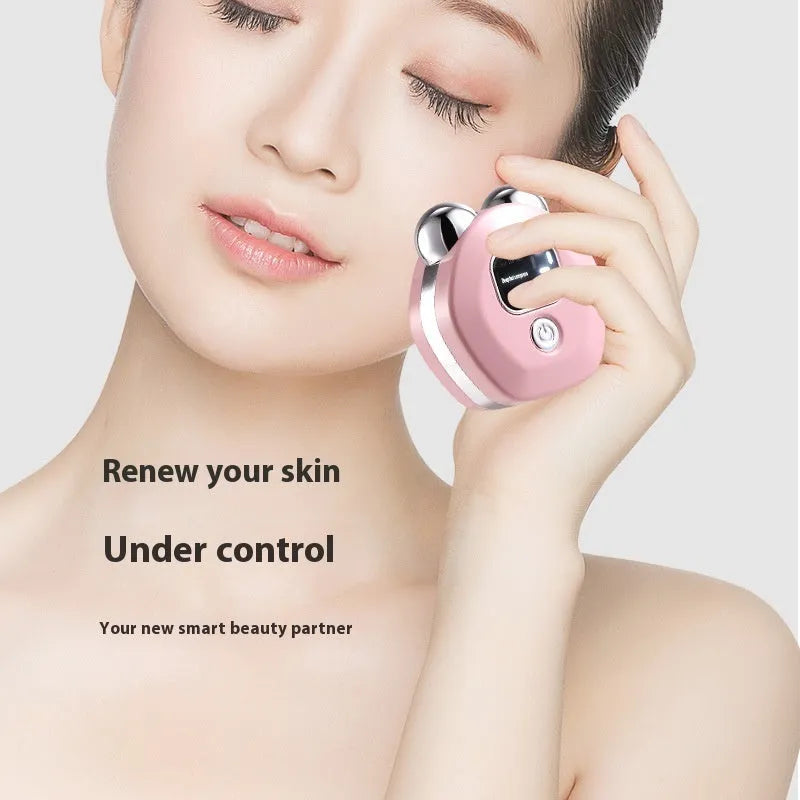 Portable white micro current facial massage instrument with double-roller head and USB charging cable.