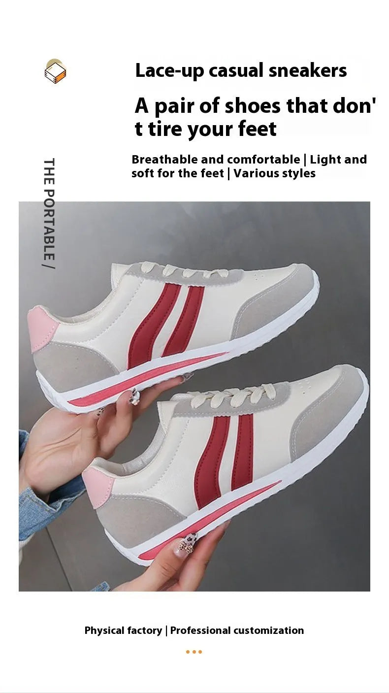 Red low-top lace-up running sneaker with round toe and rubber sole.