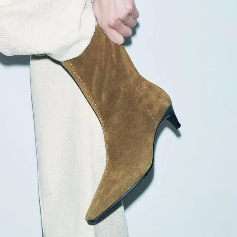 Brown women's square toe ankle boots with a side zipper and a mid stiletto heel on a waterproof platform sole.