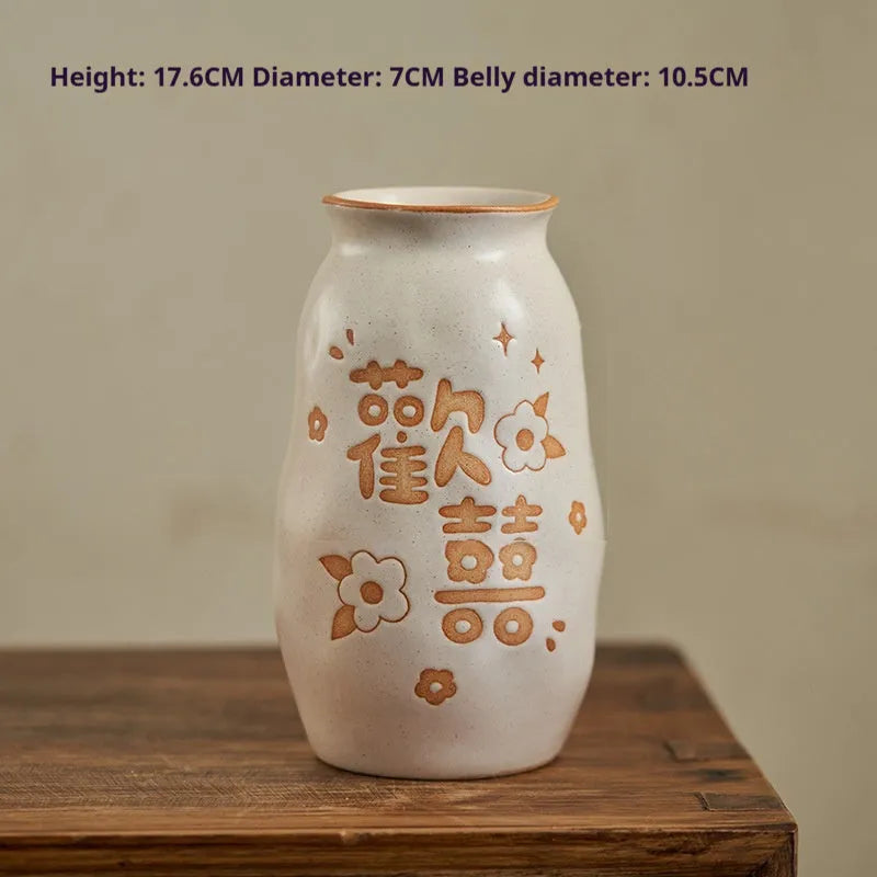 Chinese hand-painted ceramic joy vase with traditional designs and 8 cm base