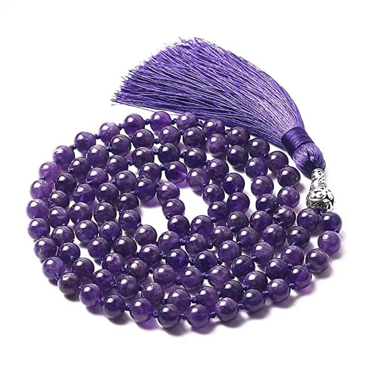 Long geometric agate and gemstone tassel necklace with blue, purple, and multi-coloured beads on a black background.