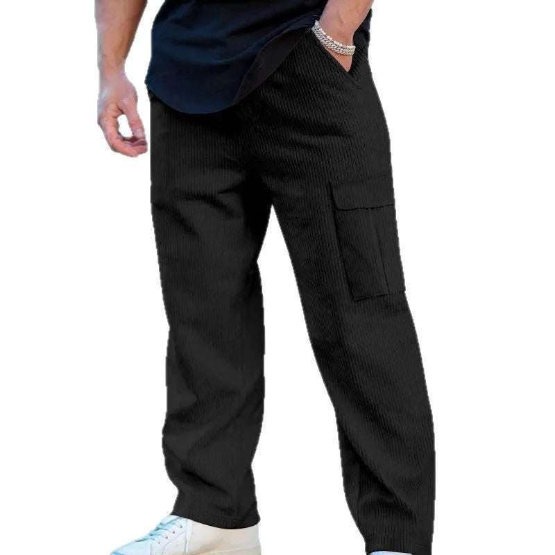 Men's corduroy cargo trousers in loose fit wide-leg design with elastic waist
