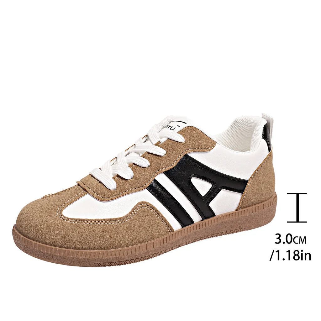 Women's retro grey jogging shoes with colour matching details, lace-up front, and a low platform heel.