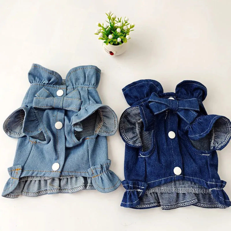 Blue denim dress for a dog or cat with ruffles and a metal leash hook on the chest.