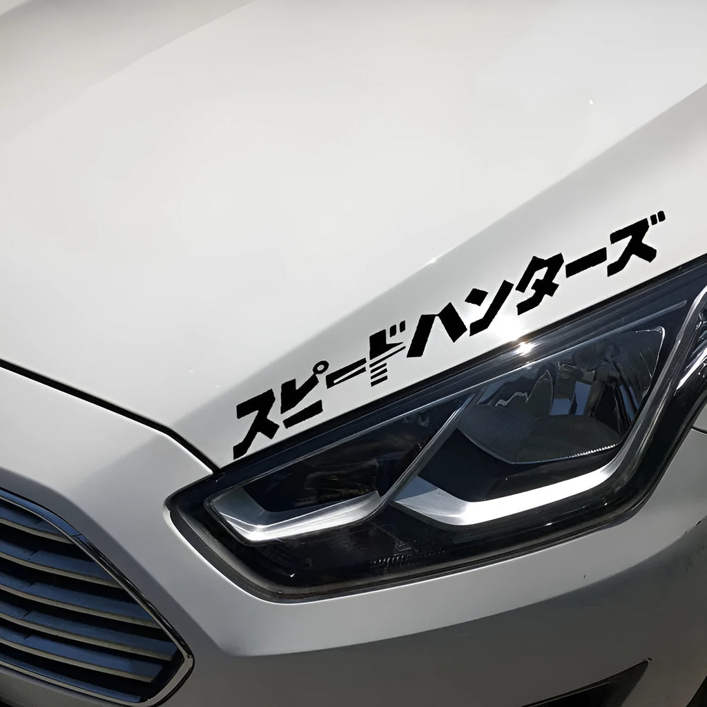 Black and white reflective Japanese car sticker measuring 35x35cm on a vehicle window.