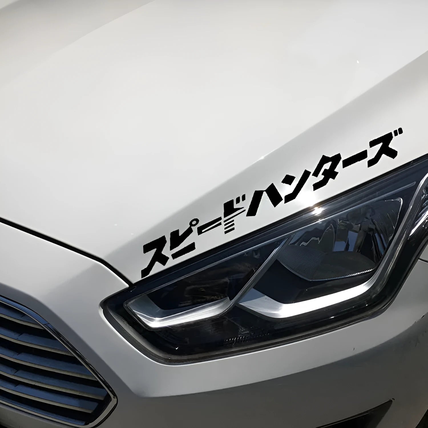 Black and white reflective Japanese car sticker measuring 35x35cm on a vehicle window.