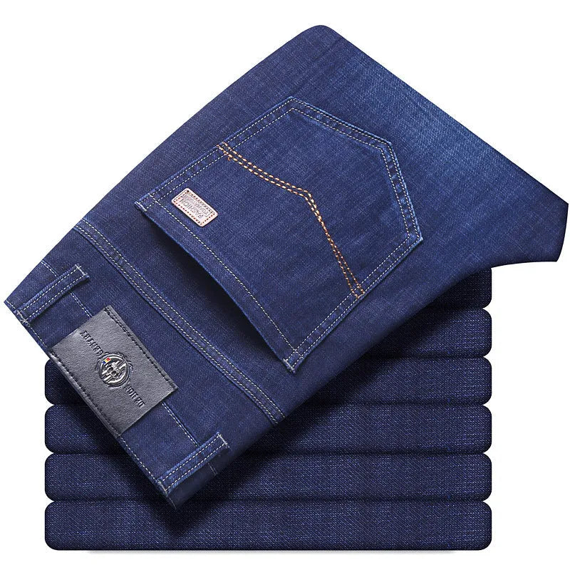 Women's loose fit, straight-leg stretch denim jeans in blue and black, showing zip fly and mid waist.