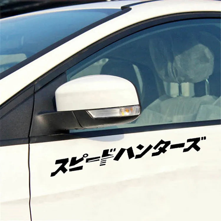 Black and white reflective Japanese car sticker measuring 35x35cm on a vehicle window.