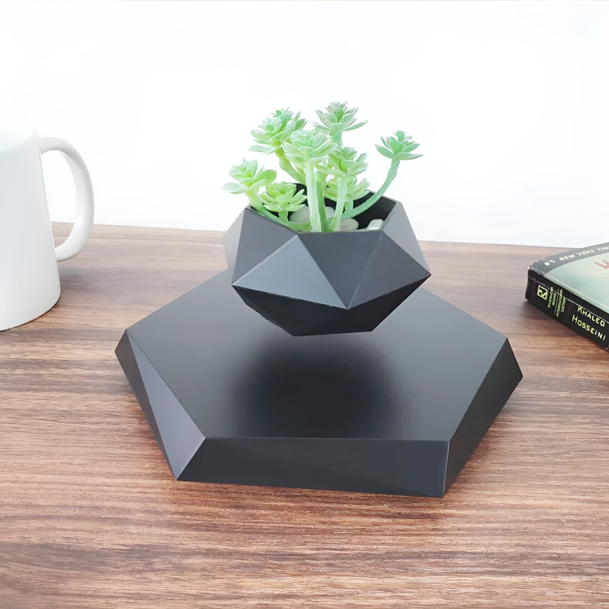 Floating magnetic levitating flower pot in wood grain finish with micro plant suspended 15mm above hexagonal base