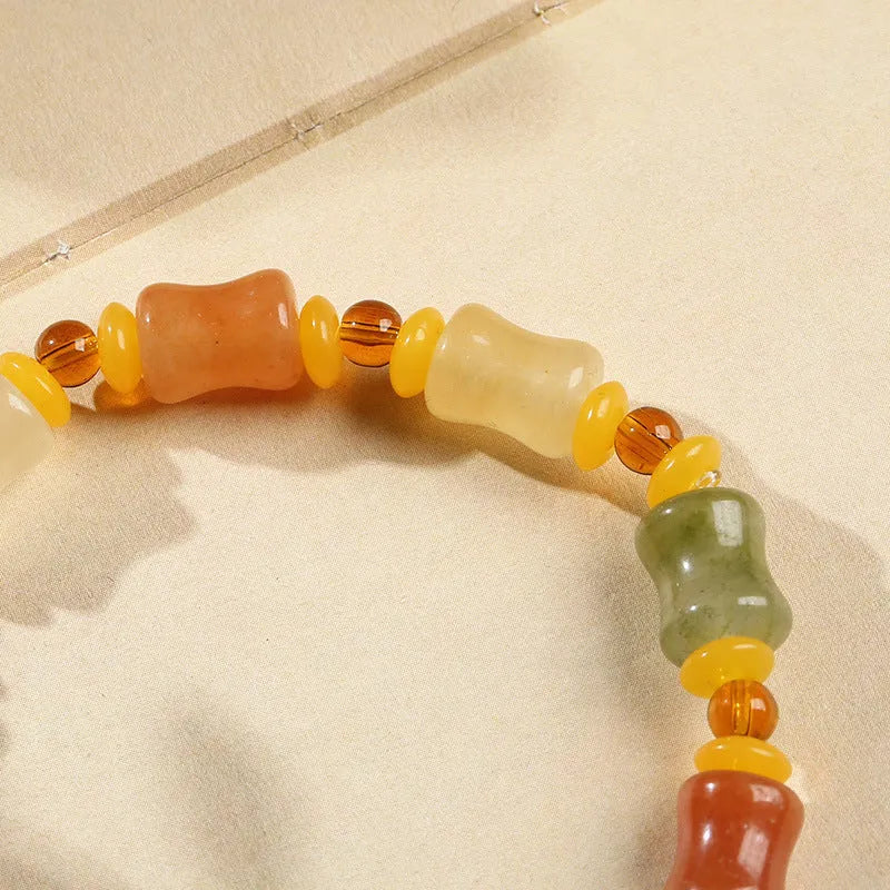 Jinsi Jade bracelet with small bone beads showing auspicious patterns and geometric design