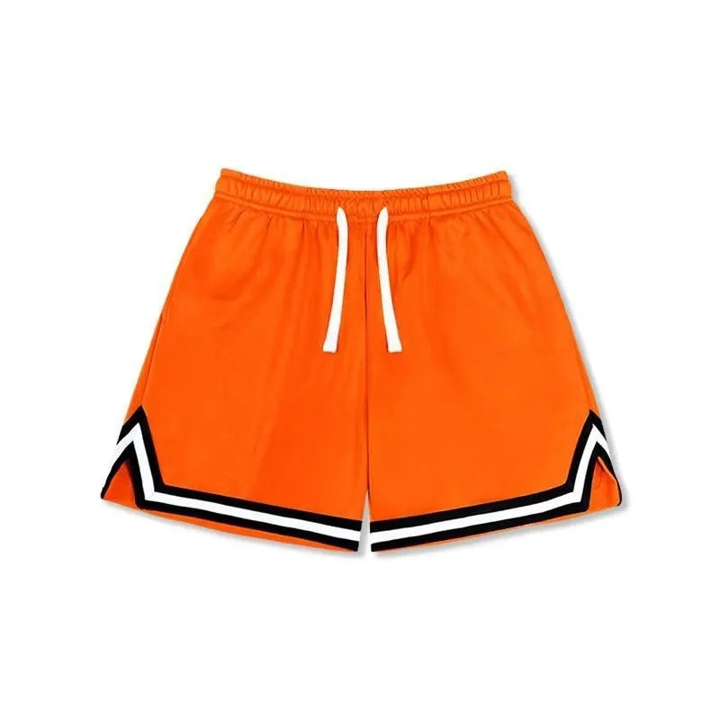 Man wearing loose fit grey polyester sports shorts on a summer day.