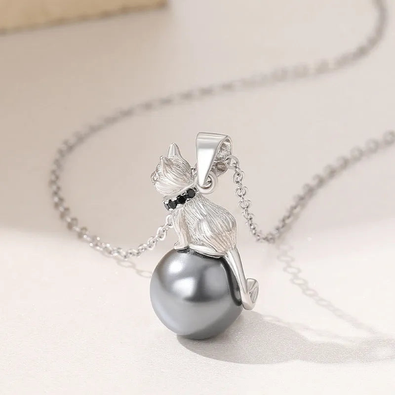 Sterling silver cat pendant necklace on a chain, showcasing the feline design in an elegant style.