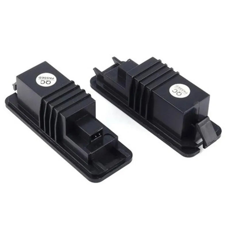 Pair of white LED license plate light bulbs for Volkswagen cars with Canbus resistors.