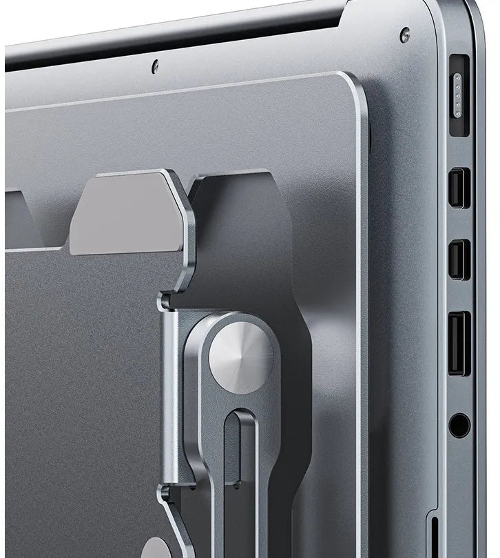 Grey adjustable aluminum laptop stand showing folding mechanism and hollow cooling design