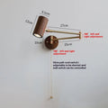 Retro rotating wall lamp with long adjustable arm and integrated switch in walnut wood finish