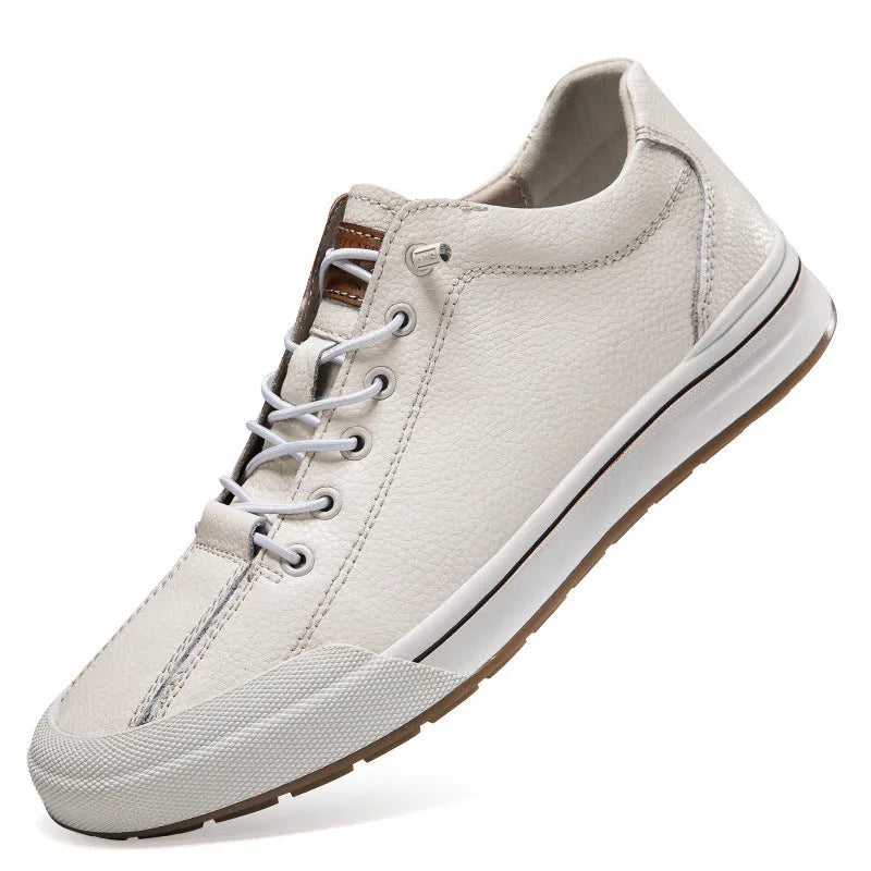 Men's white round toe matte leather casual shoes with flat heel on a plain background.