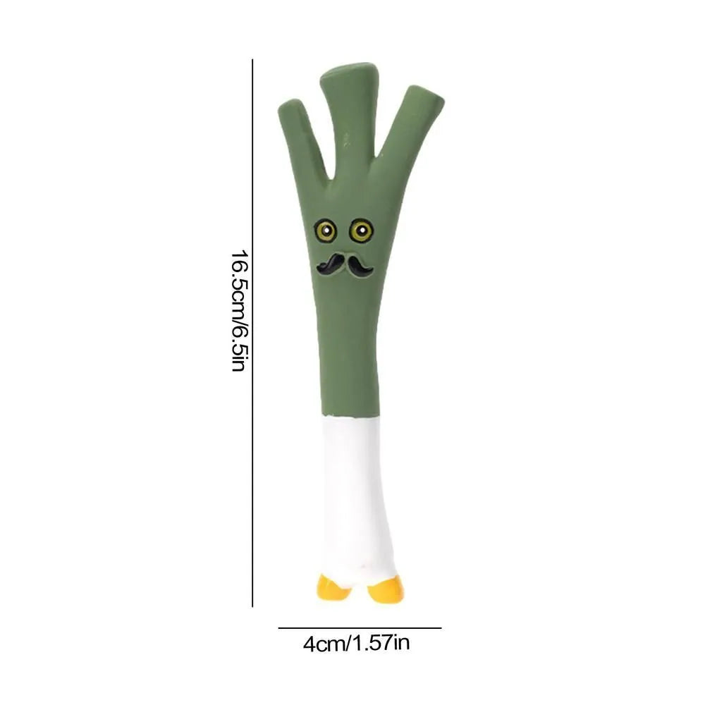 Green, orange, and purple latex vegetable dog chew toys with cartoon onion and eggplant designs