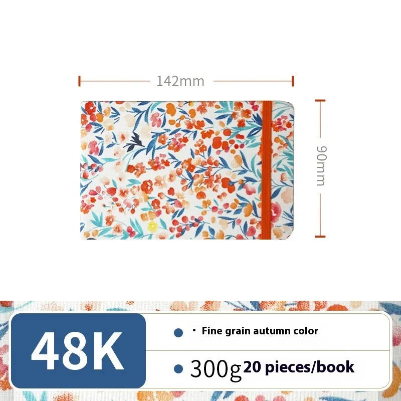 Feiluniao handmade fabric watercolour notebook in 185mm portable size, showing artistic cover design.