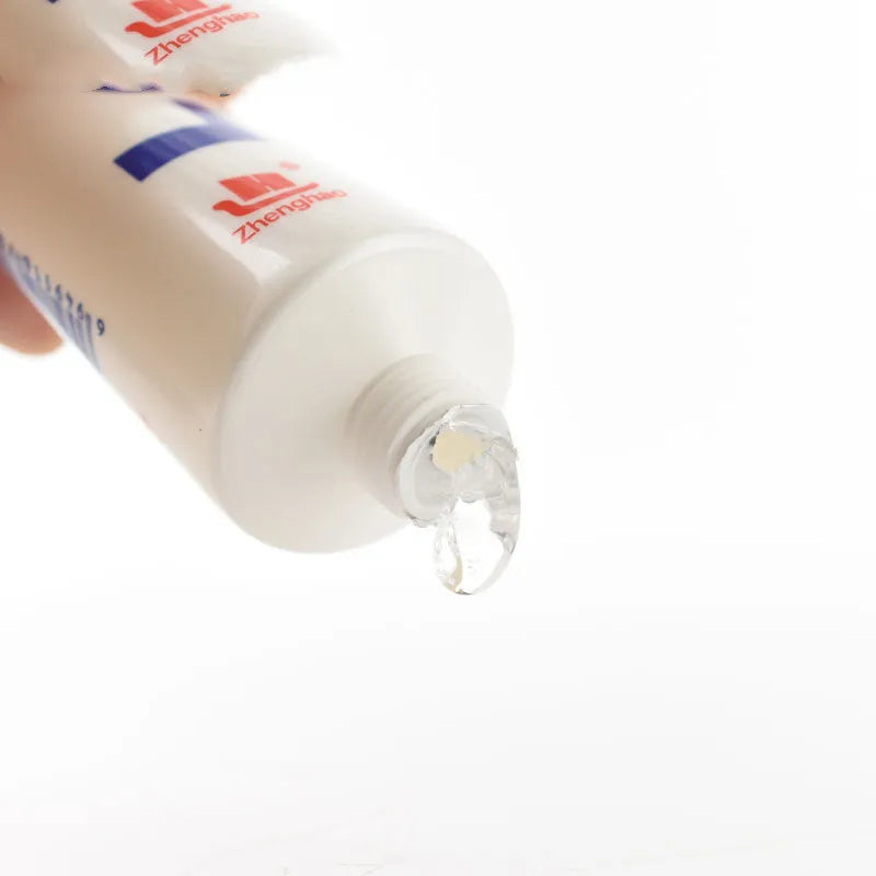 White bottle of cherry flavoured water-soluble lubricant 100ml with catheter option