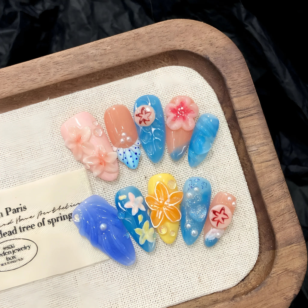 Three-dimensional carved jellyfish plastic wearable armour set in almond nail colour with rose and tulip patterns