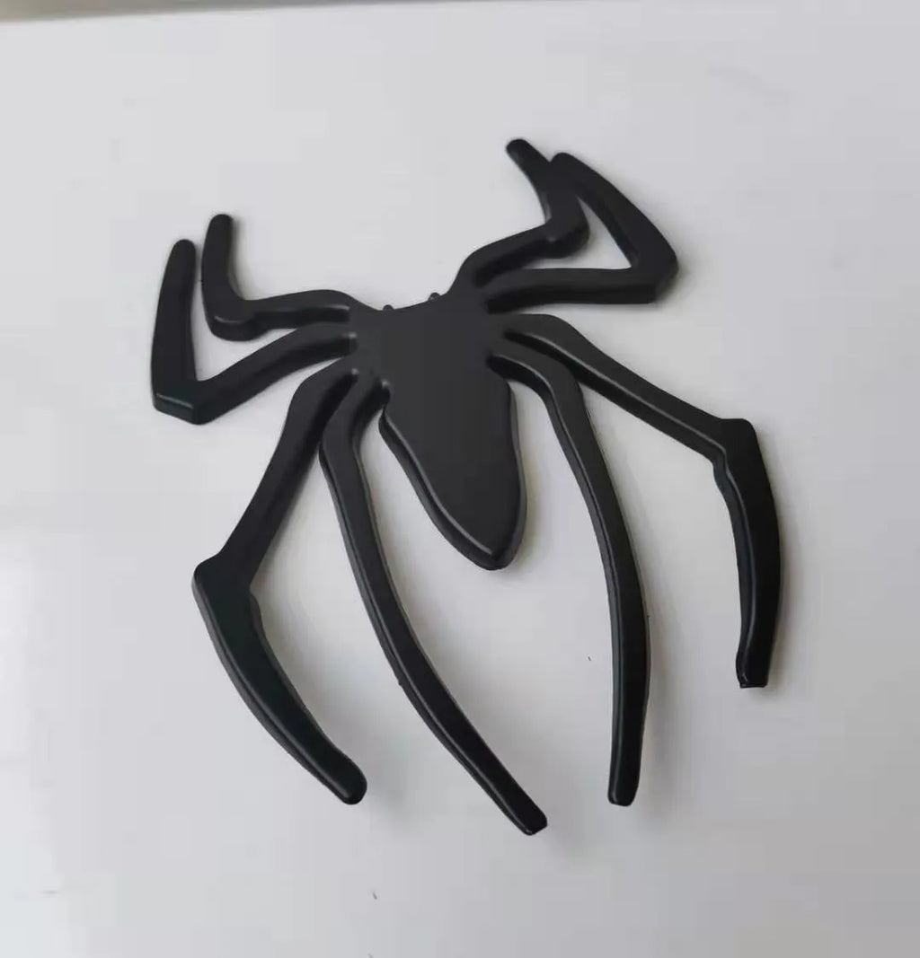 Zinc alloy 3D metal spider car sticker in gold, silver, black, and red colours.