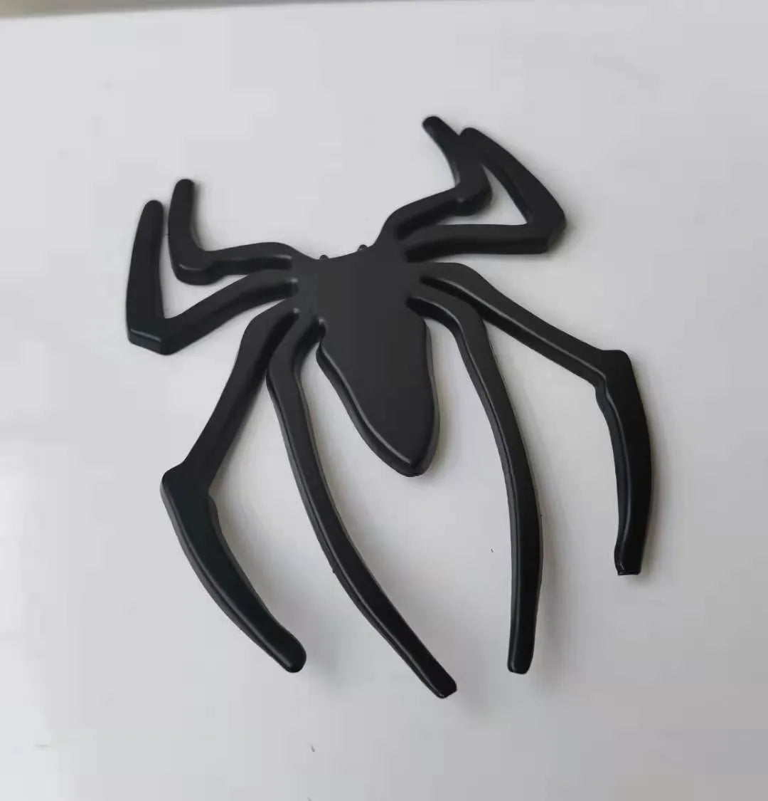 Zinc alloy 3D metal spider car sticker in gold, silver, black, and red colours.