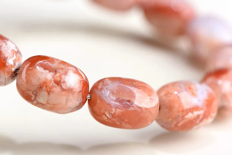 Natural cherry agate barrel bead bracelet with Ruyi pattern geometric design