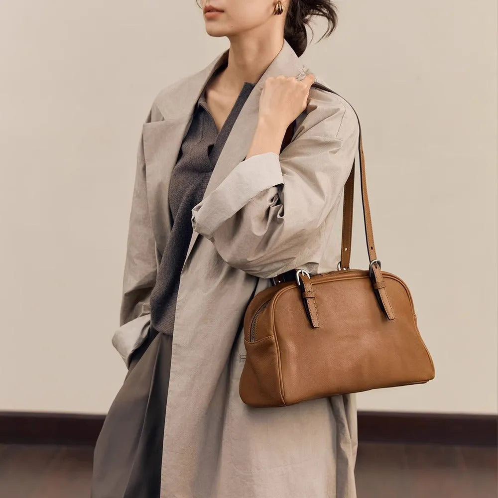 Women's genuine leather retro shoulder bag in horizontal square shape with double straps.