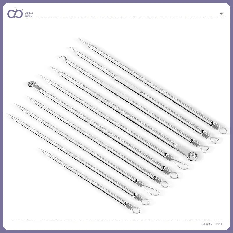 Four silver metal acne needles with fine pointed tips laid out on a flat surface.