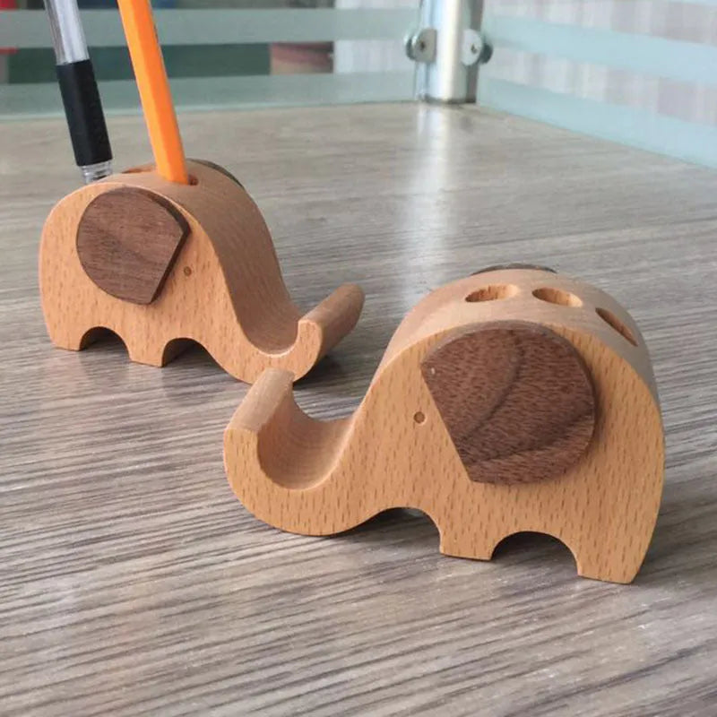 Decorative resin mobile phone stand in a choice of styles including animal figures and wood-effect designs.