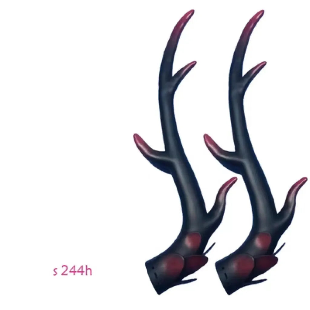A pair of detailed black resin dragon horn decorations for customising motorcycle and scooter helmets.
