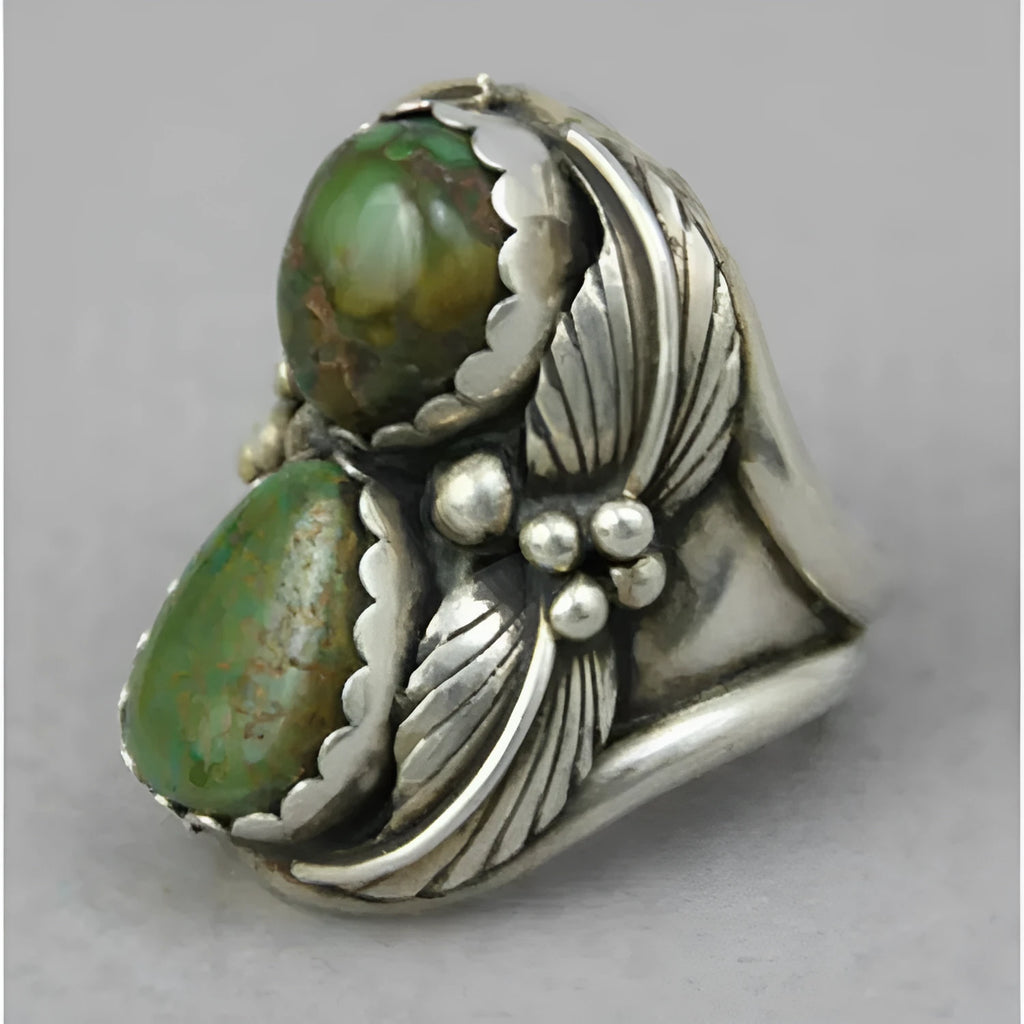 Women's geometric alloy ring with a turquoise inlay on a hand, showing its retro style.