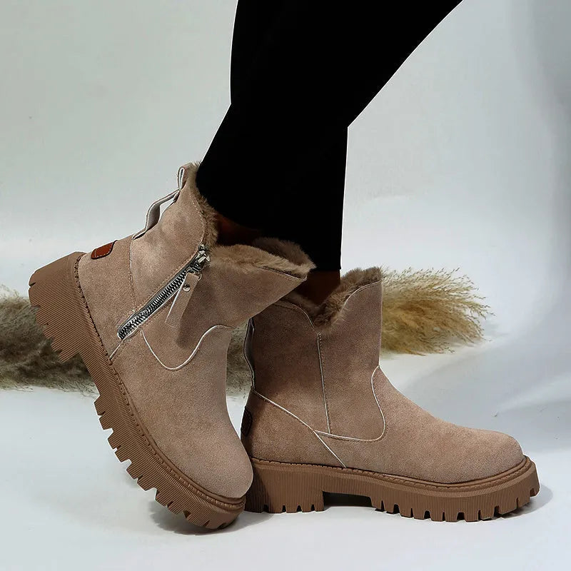 Women's black faux suede high-top snow boots with side zipper and thick plush lining.