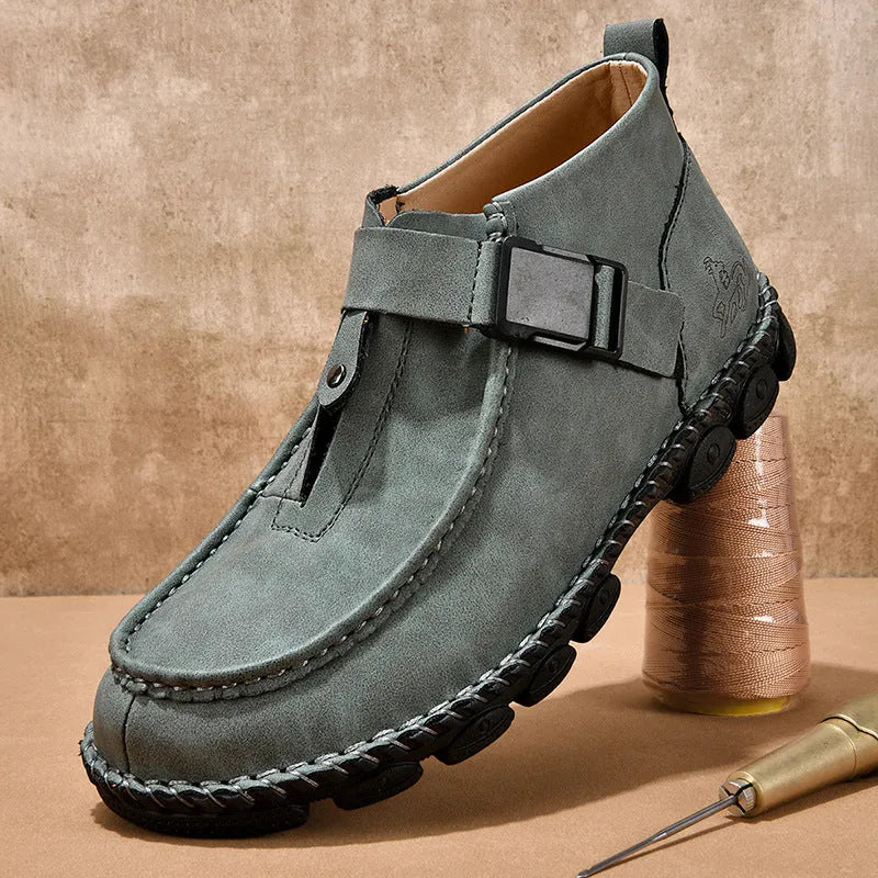 Black handmade stitching flat bottom slip on lazy shoes with low heel on a plain background
