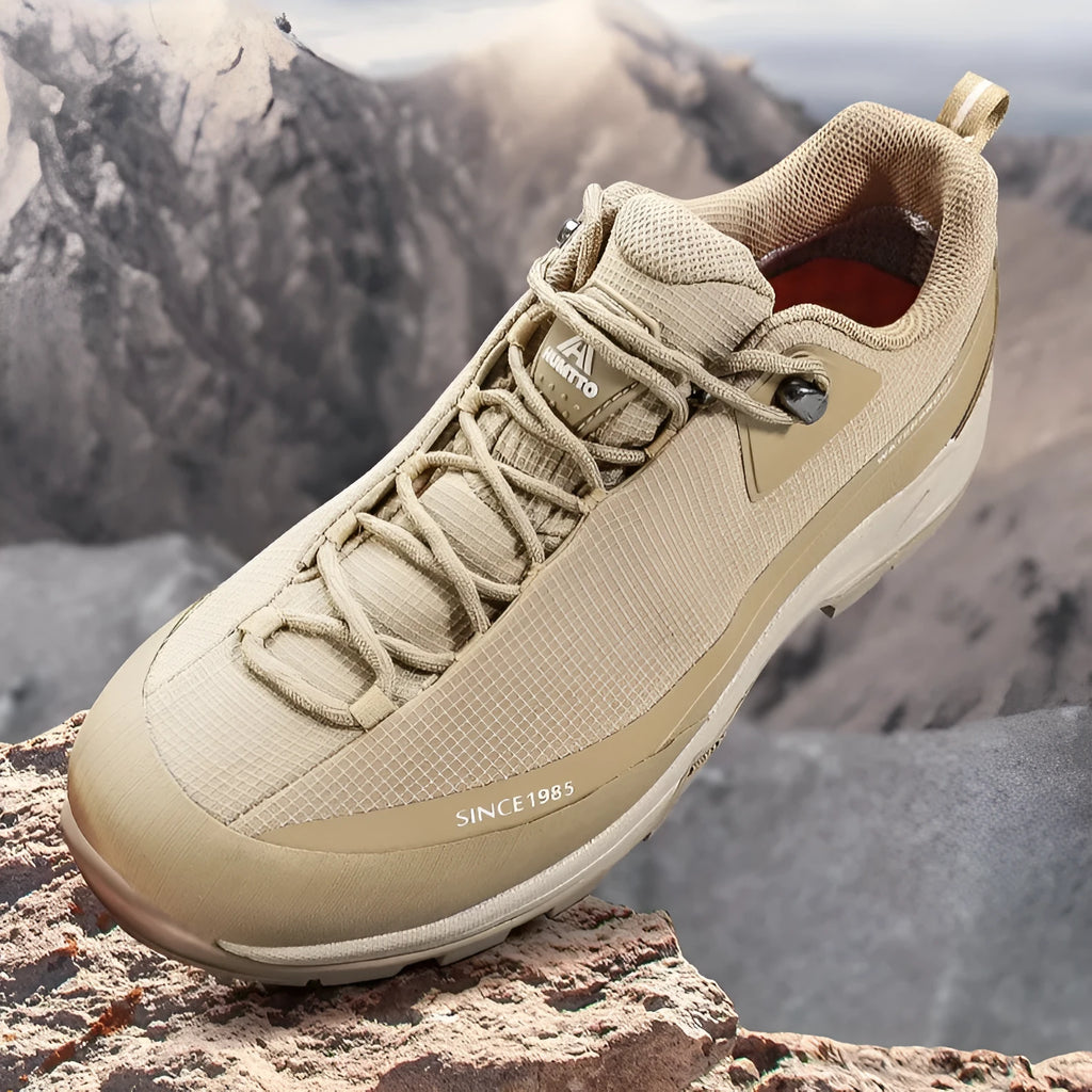 Men's low-top mountain climbing shoes with leather mesh upper and non-slip rubber outsole in black colour