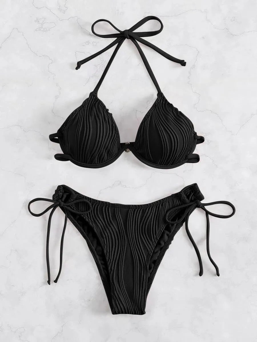 Women's black bikini swimsuit with steel underwire support on a mannequin.