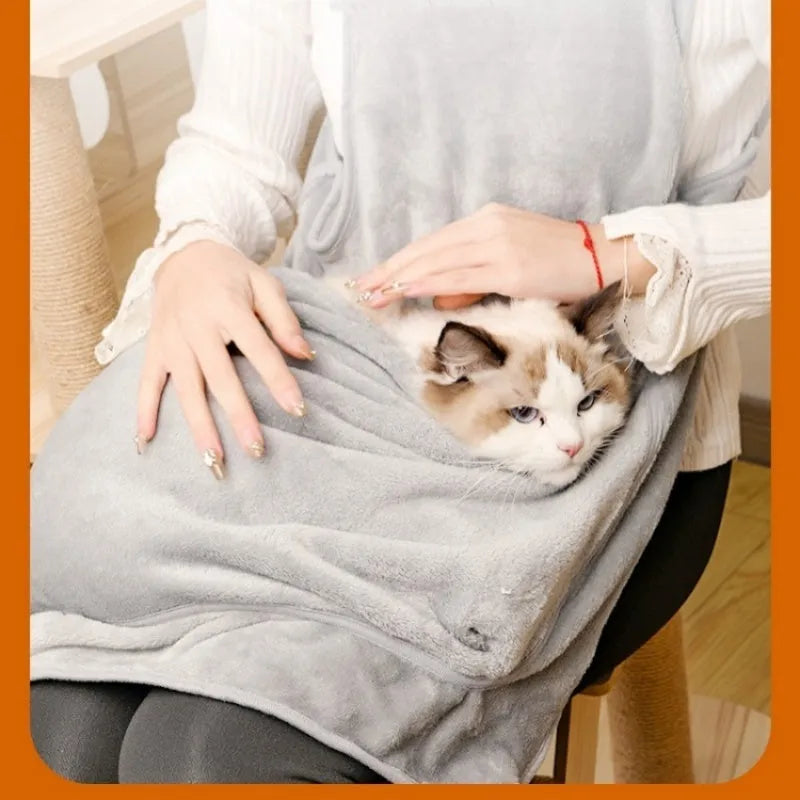 Plush pet carrier apron for small cats and dogs showing adjustable neck strap and pet opening