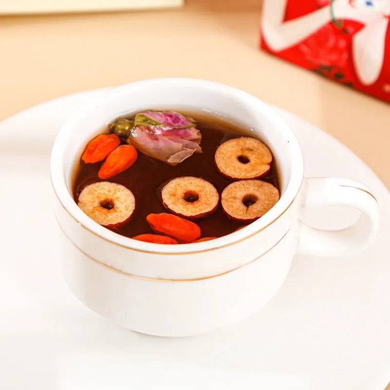 Box of brown sugar ginger and jujube tea with red dates, wolfberries, and herbal ingredients