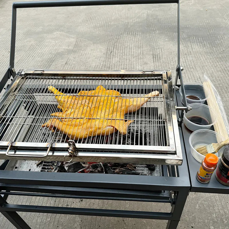 Large foldable portable charcoal BBQ grill and stove for courtyard use.