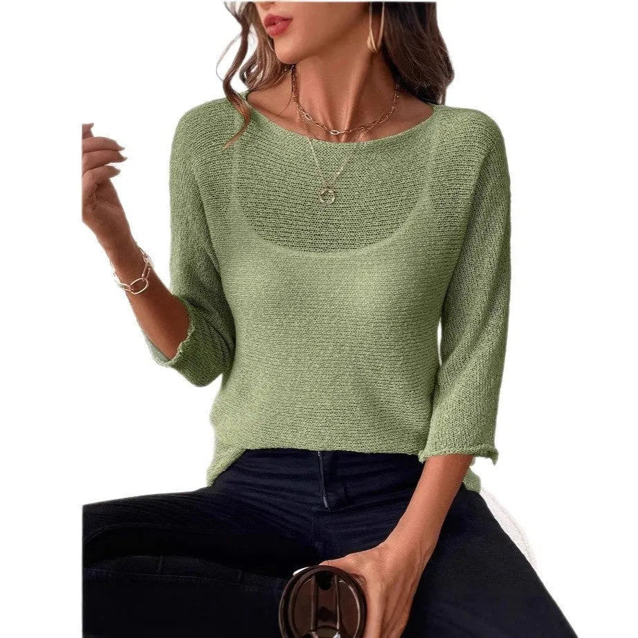Women's light grey knitted off-shoulder top with a 3D textured pattern on a hanger.