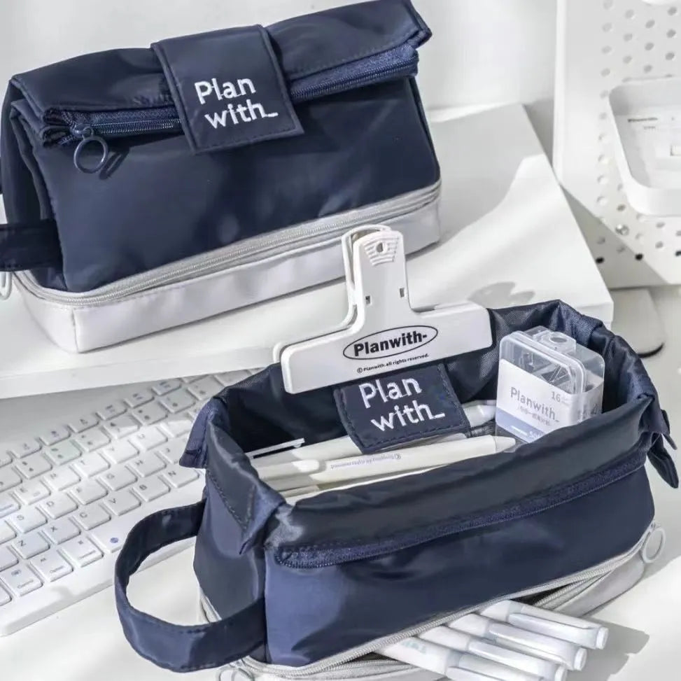Folding double layer student pencil case in polyester fabric, shown in dark blue colour.