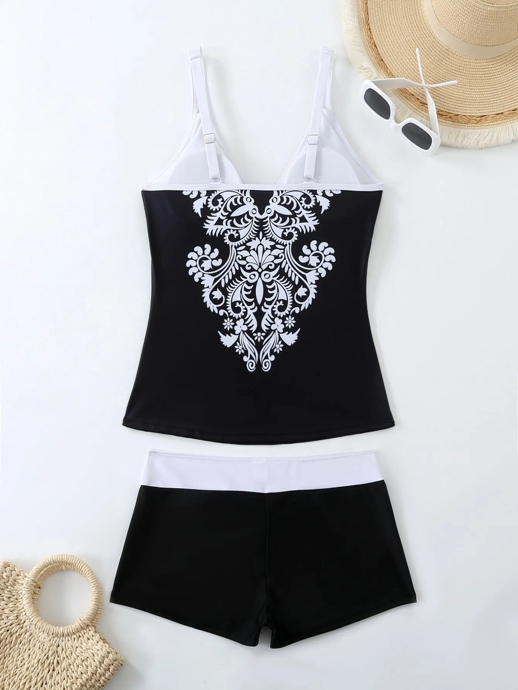Women's black plus size brief swimsuit and swimming trunks set with a cotton lining.