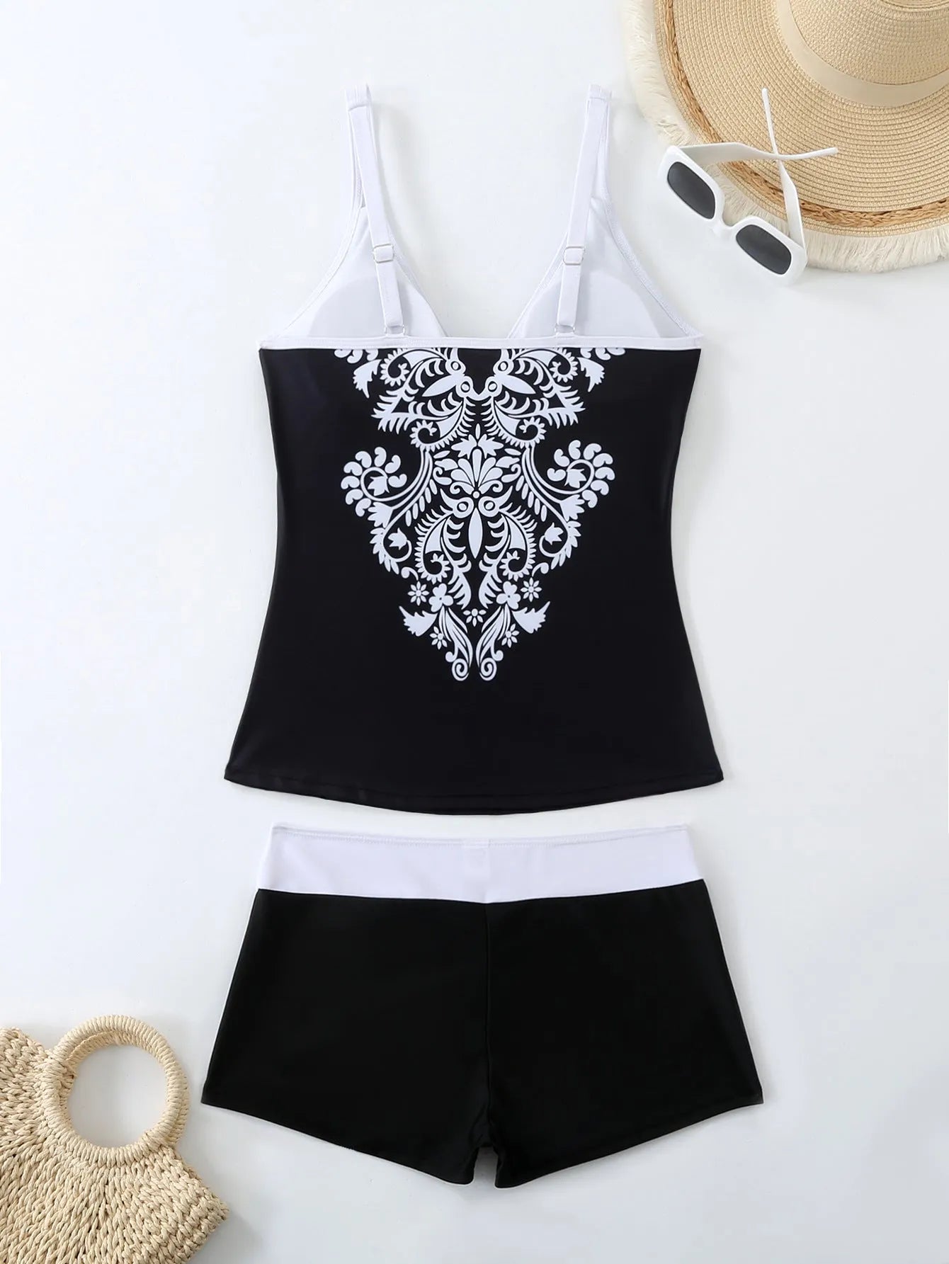 Women's black plus size brief swimsuit and swimming trunks set with a cotton lining.
