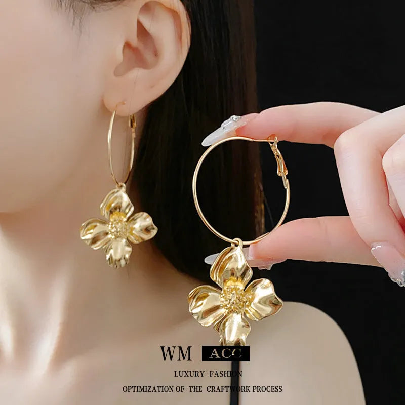 Silver needle metal flower earrings with geometric design in gold and silver electroplated finish