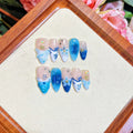 Blue hand-painted carved false nails on transparent summer base with XS, S, M, L size options